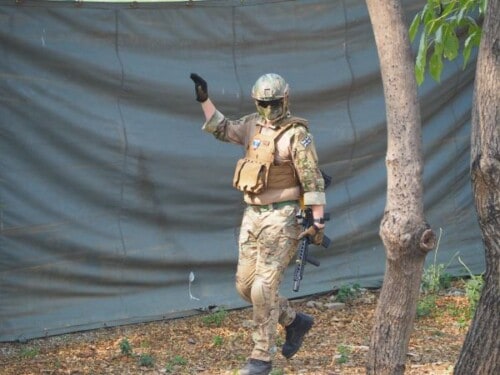 airsoft player calling a hit