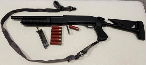 CYMA airsoft shotgun with spare shells and bb loader