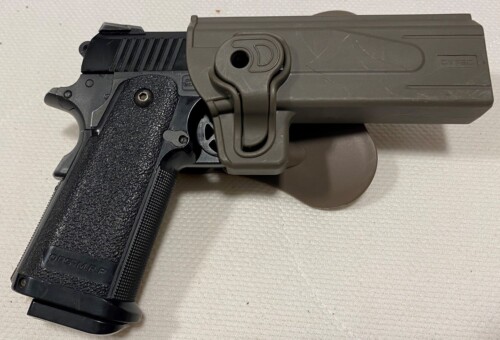 Airsoft HiCapa pistol in holster