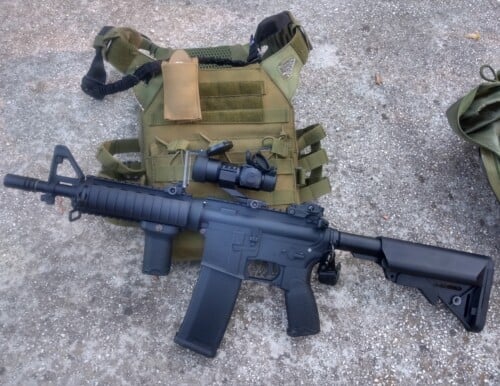 airsoft replica with a plate carrier